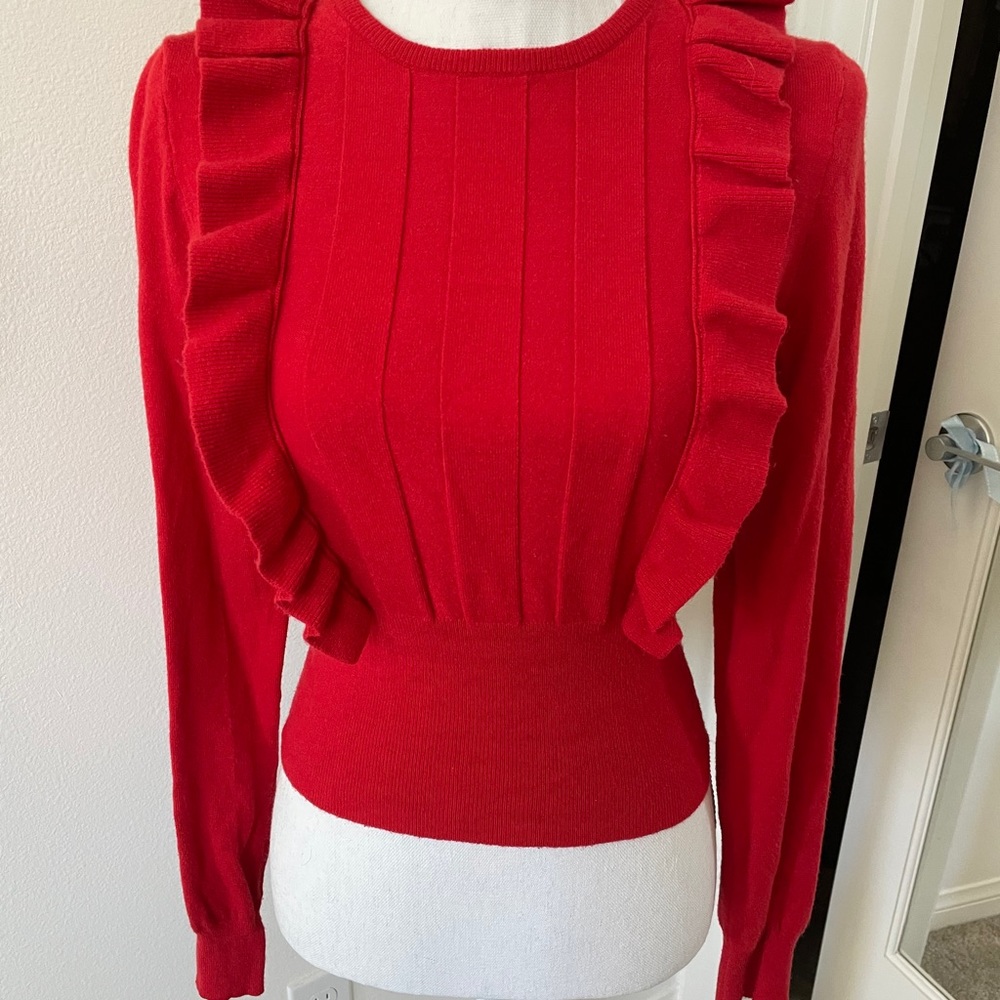 Red sweater with ruffle accent